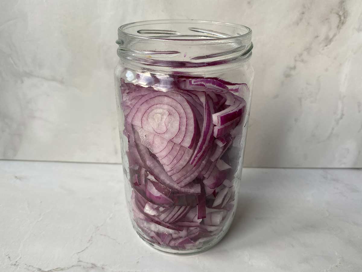 Step 2 Place the chopped onion in a clean glass jar