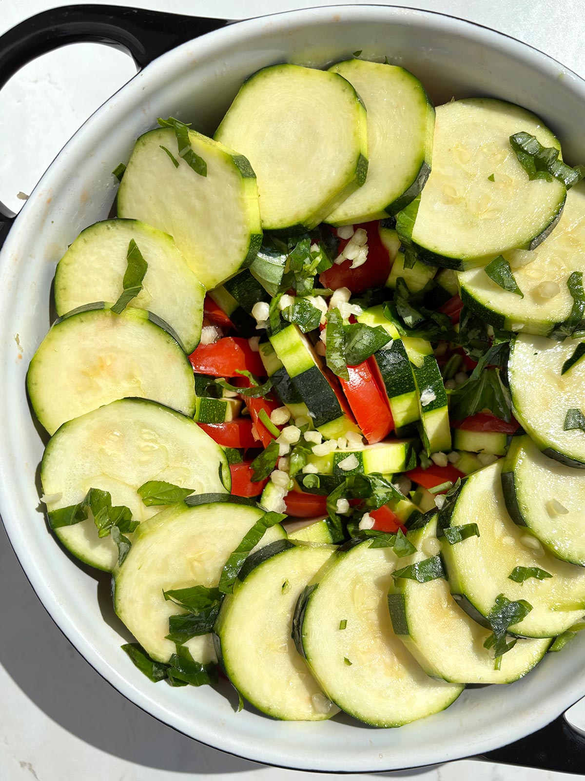 Courgette and tomato gratin before baking