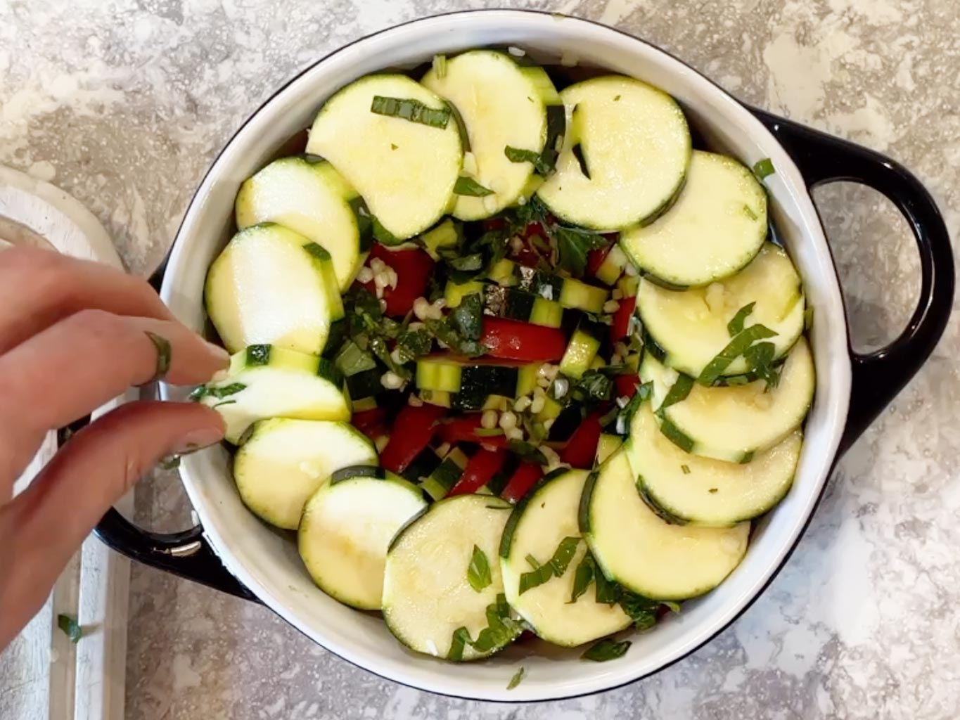 Arranging courgette in baking tray