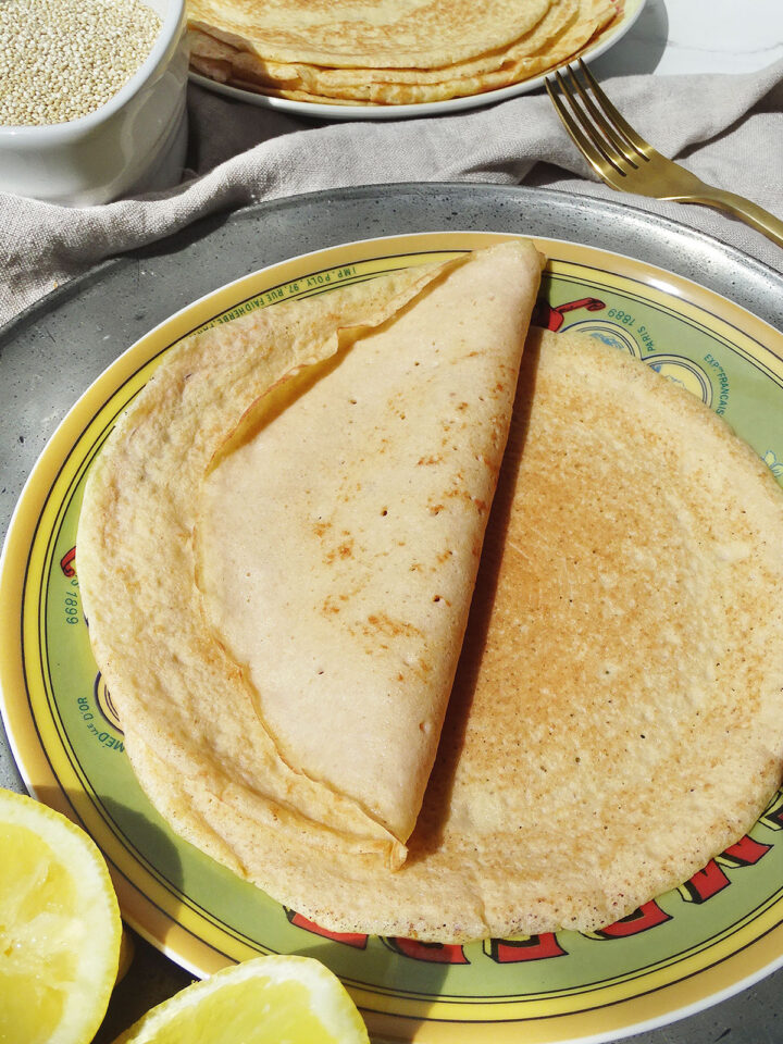 Two crepes on a green plate
