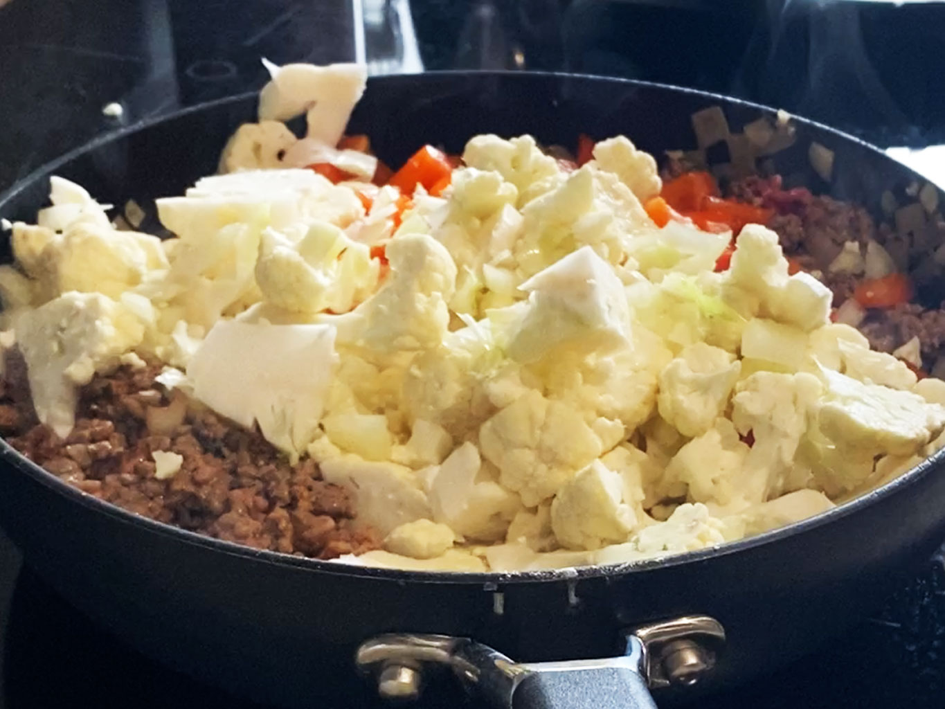 Add cauliflower and pepper to breakfast scramble