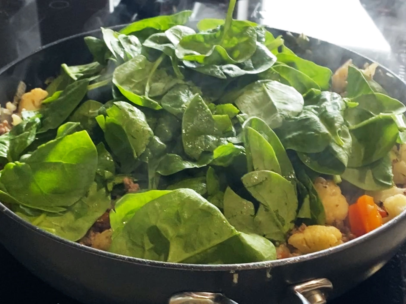 Add fresh spinach to breakfast scramble