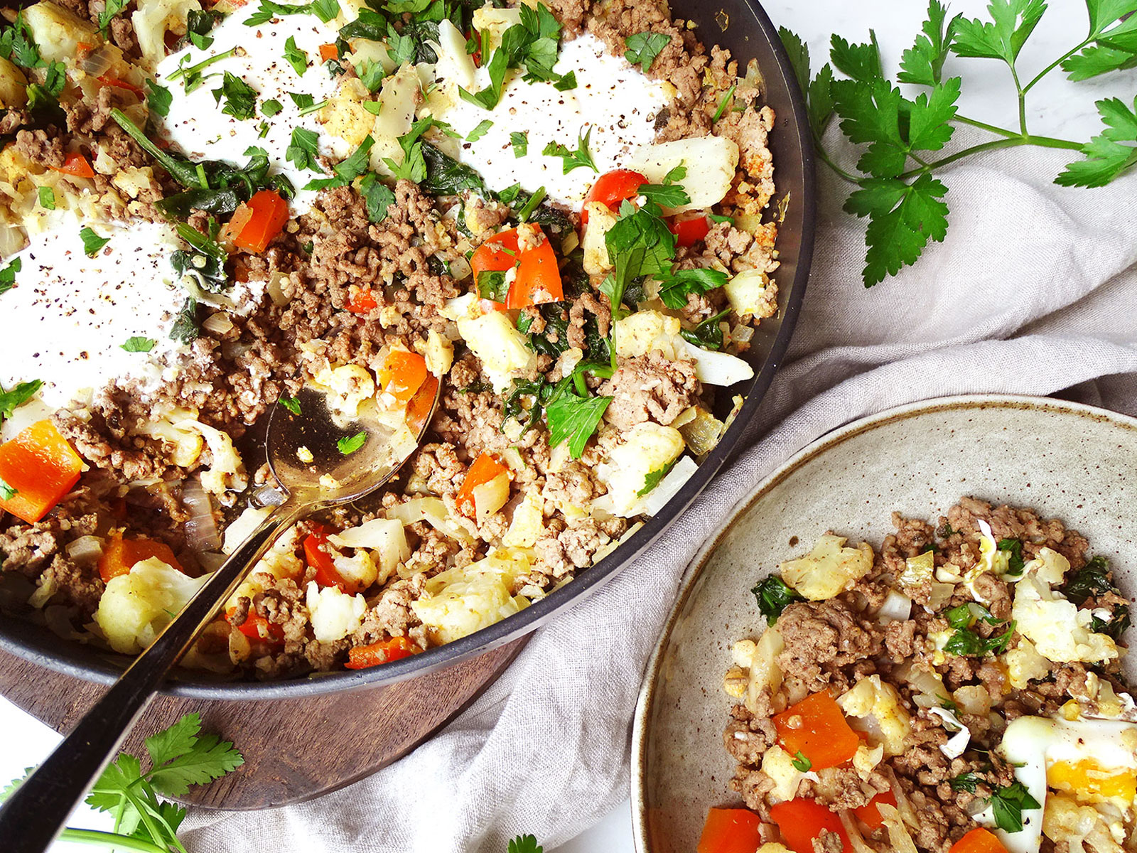 High protein breakfast scramble with ground beef and eggs being served