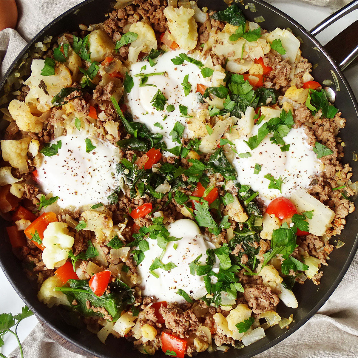 Top view high protein breakfast scramble with ground beef and eggs