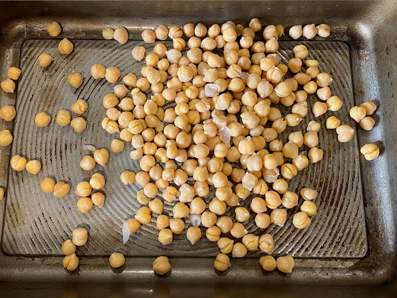 Spread the cooked chickpeas on a baking sheet.
