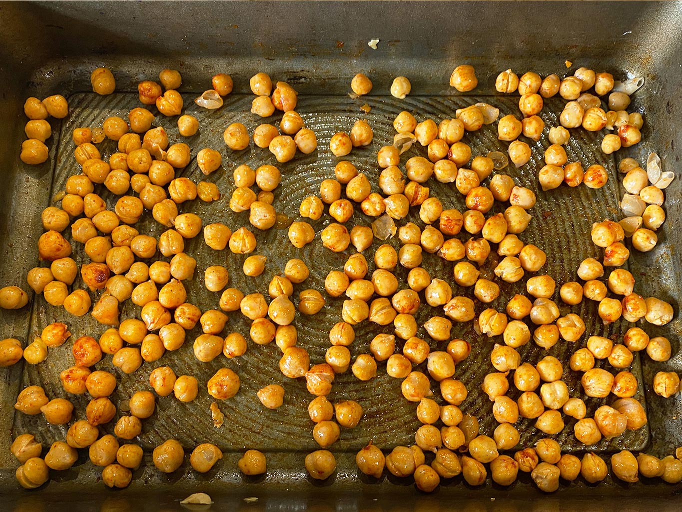 Toss the chickpeas in coconut oil, cumin, oregano, and a pinch of salt.