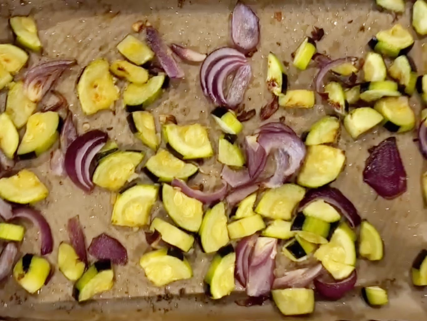 Bake zucchini and red onion in the oven
