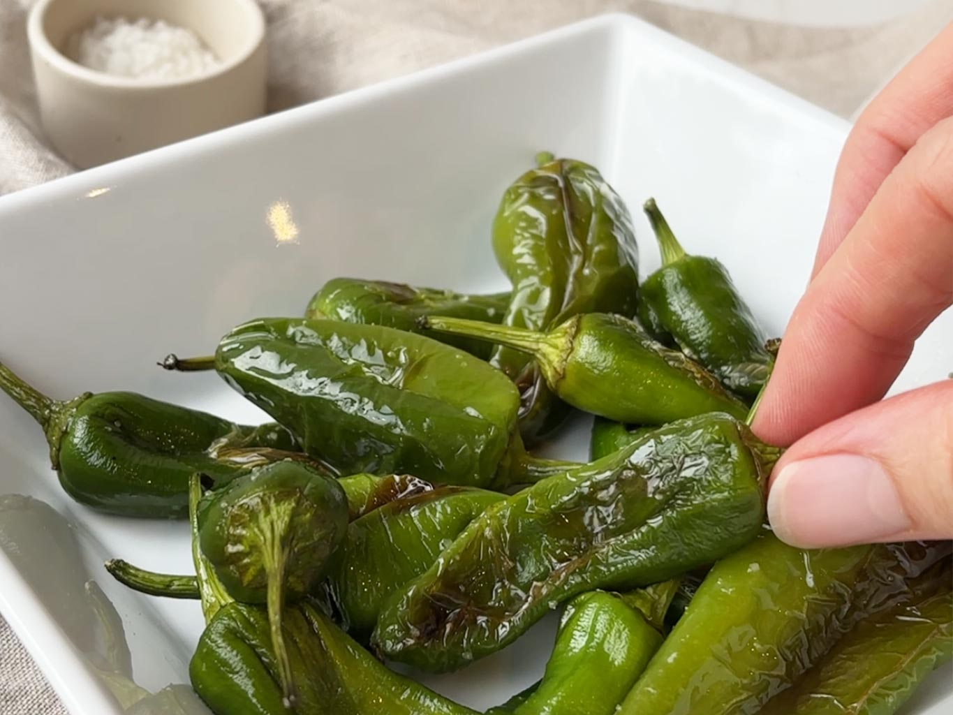 Grilled padron peppers with extra virgin olive oil and flaky sea salt