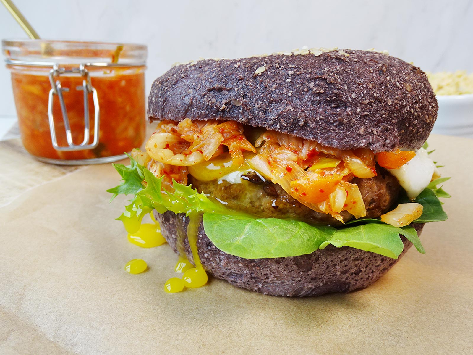 Gluten free kimchi burgers with a fried egg - side view